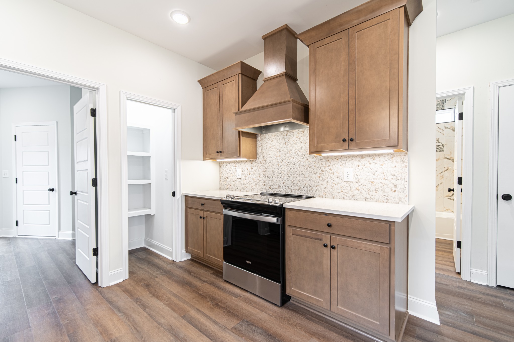 244 Franklin Street Pleasant View, TN 37146 - Photo 11 of 35 a kitchen with stainless steel appliances granite countertop a stove and a refrigerator