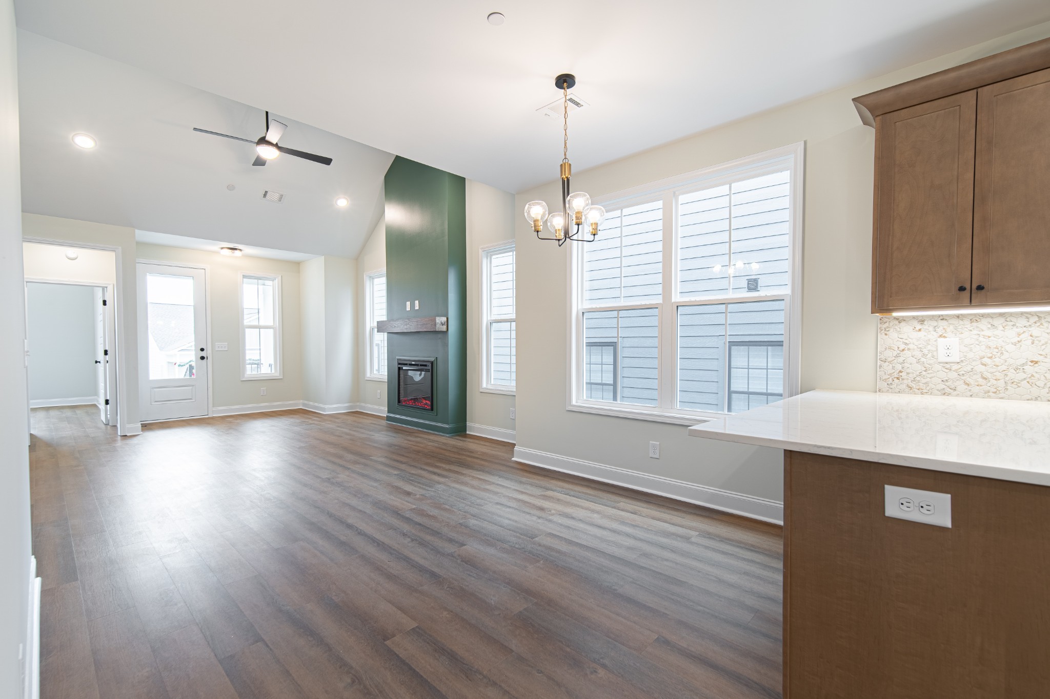 244 Franklin Street Pleasant View, TN 37146 - Photo 12 of 35 an empty room with wooden floor and windows
