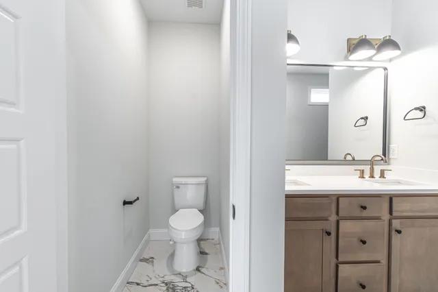 an empty room with a ceiling fan and window