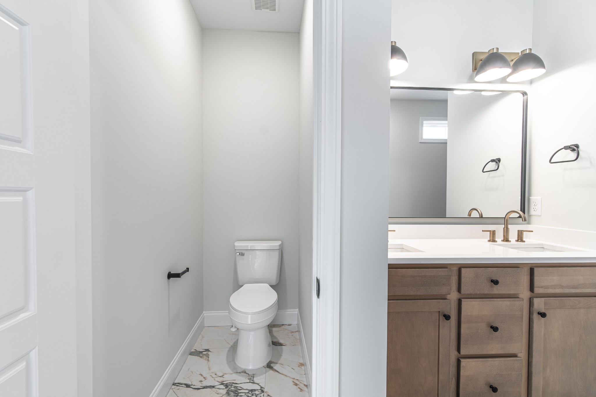 244 Franklin Street Pleasant View, TN 37146 - Photo 27 of 35 a bathroom with a toilet a sink and mirror