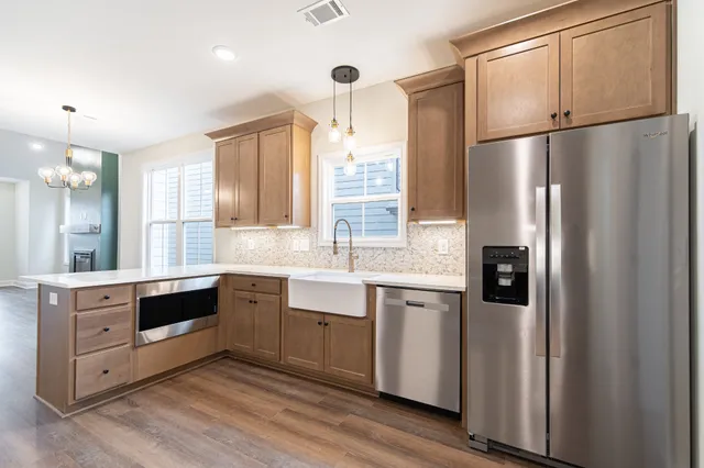 a bathroom with a tub sink and mirror