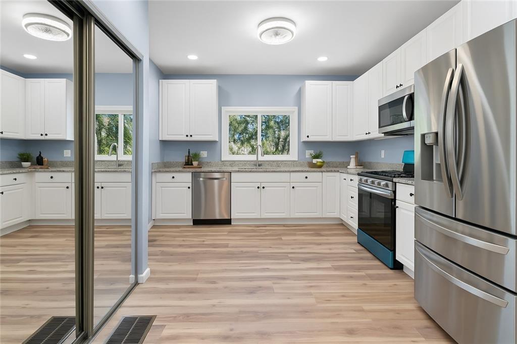 1105 Stock Street Pittsburgh, PA 15207 - Photo 14 of 37 a kitchen with stainless steel appliances granite countertop a refrigerator sink and stove
