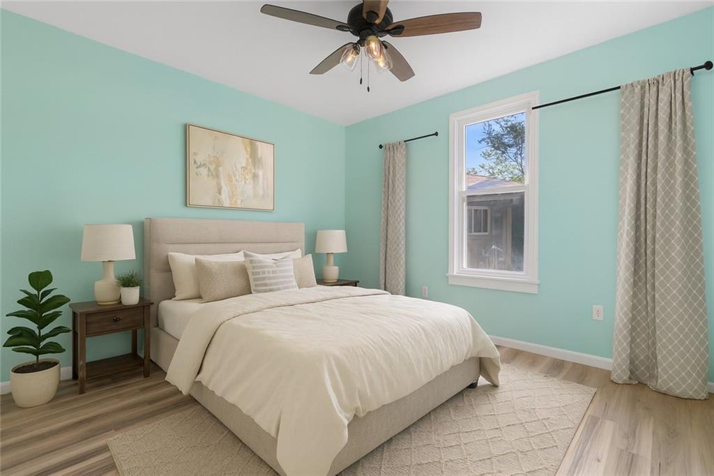 1105 Stock Street Pittsburgh, PA 15207 - Photo 17 of 37 a bedroom with a bed and a window