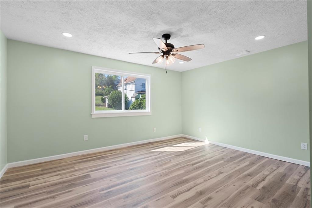 1105 Stock Street Pittsburgh, PA 15207 - Photo 23 of 37 a view of empty room with wooden floor