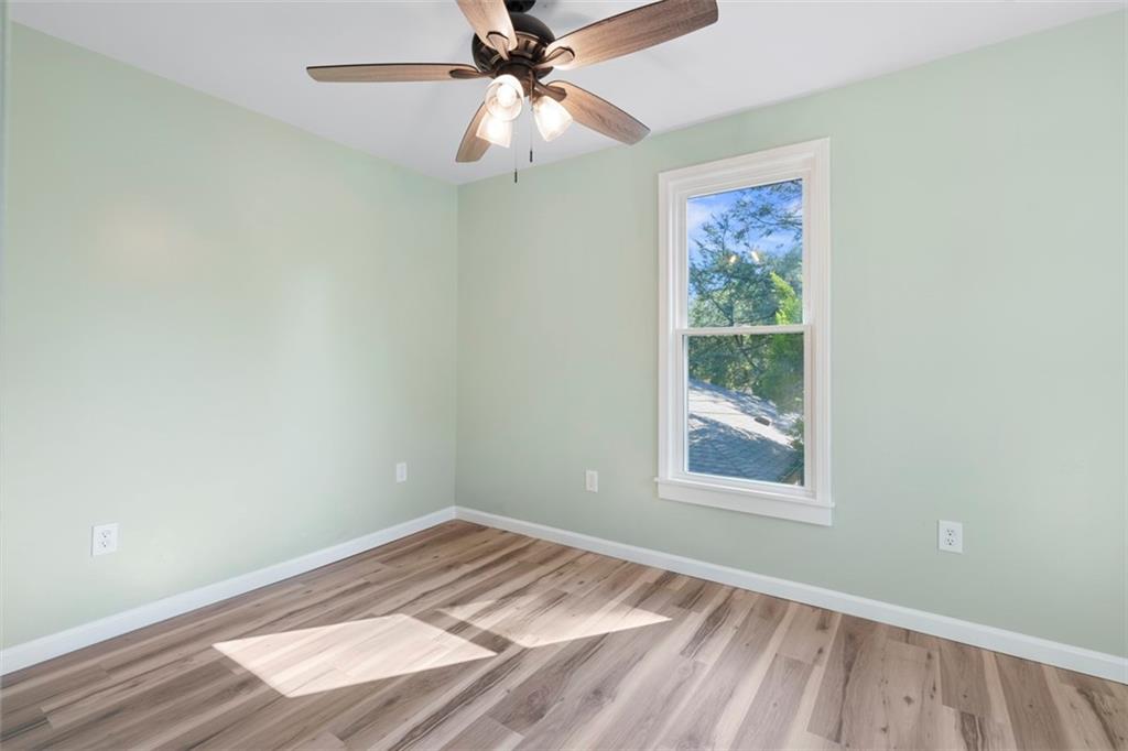 1105 Stock Street Pittsburgh, PA 15207 - Photo 28 of 37 an empty room with a window and a fan