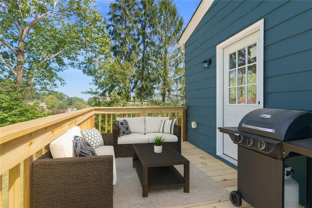1105 Stock Street Pittsburgh, PA 15207 - Photo 31 of 37 a balcony with wooden floor and outdoor seating