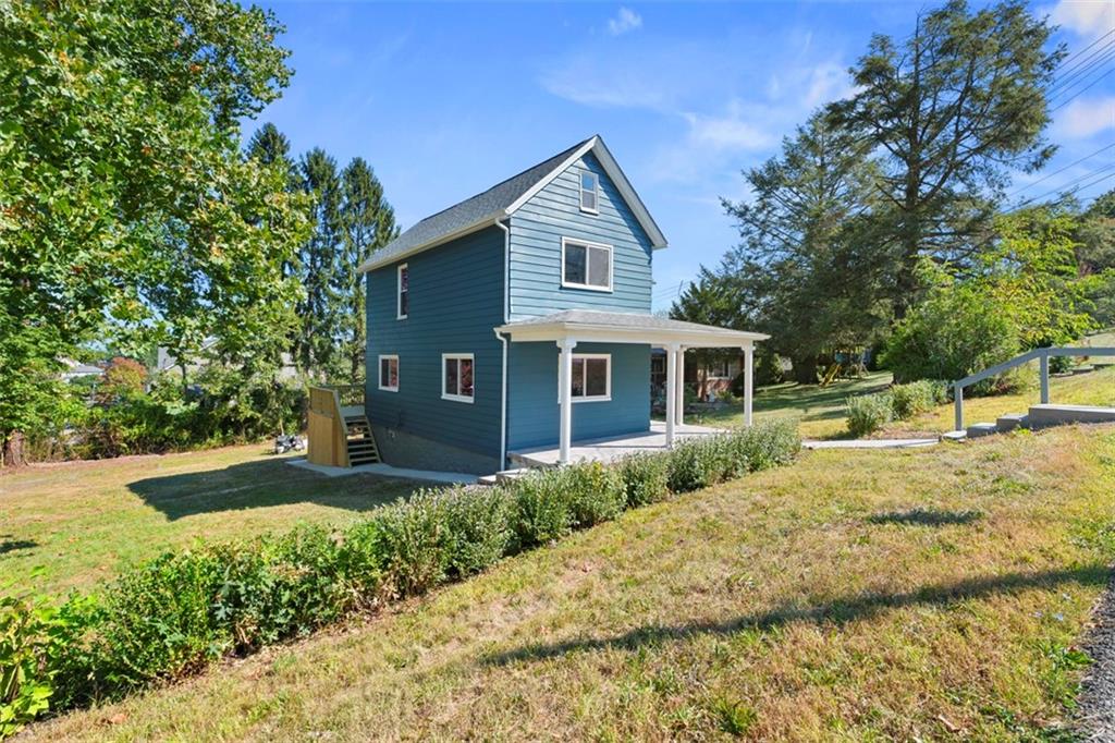 1105 Stock Street Pittsburgh, PA 15207 - Photo 36 of 37 a front view of a house with a yard