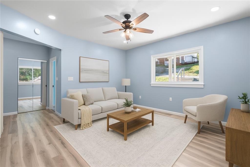 1105 Stock Street Pittsburgh, PA 15207 - Photo 4 of 37 a living room with furniture and a window