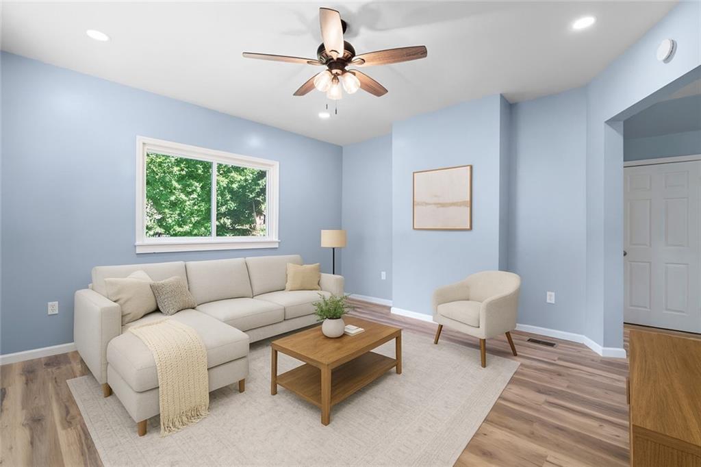 1105 Stock Street Pittsburgh, PA 15207 - Photo 5 of 37 a living room with furniture and a window