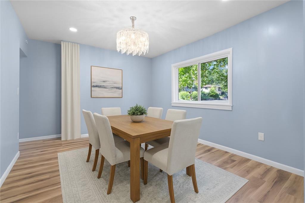 1105 Stock Street Pittsburgh, PA 15207 - Photo 9 of 37 a view of a dining room with furniture and wooden floor