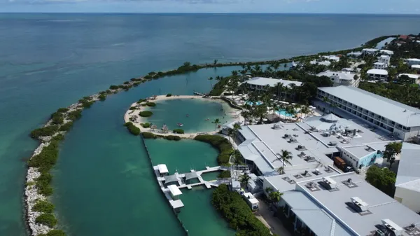 an aerial view of a house with a lake view