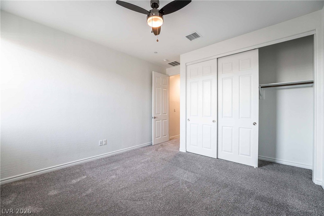 2787 Athens Ridge Drive Henderson, NV 89052 - Photo 25 of 31 A well-proportioned bedroom with ample storage and soft carpeting underfoot.
