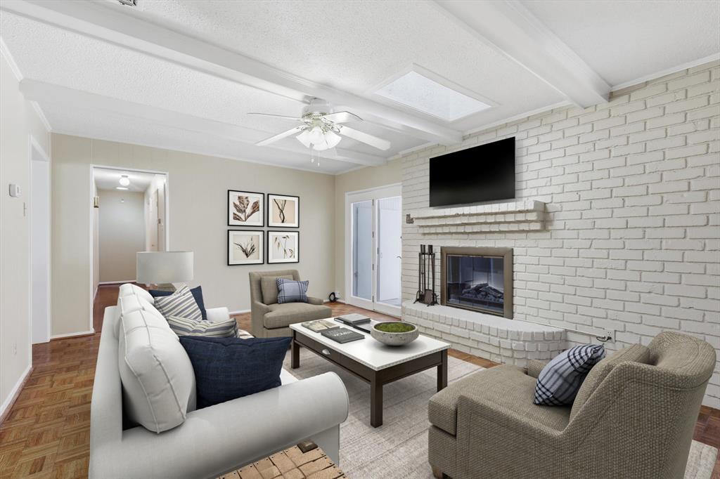 503 Summit Ridge Drive Euless, TX 76039 - Photo 11 of 38 a living room with furniture a flat screen tv and a fireplace