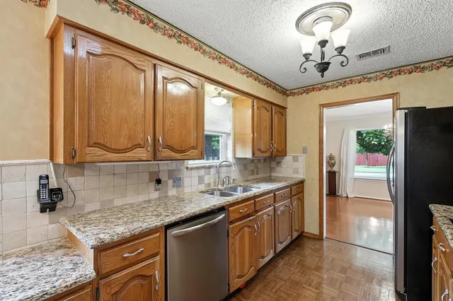 a open kitchen with a table and chairs