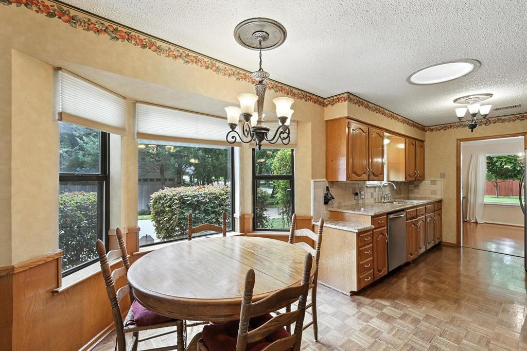 503 Summit Ridge Drive Euless, TX 76039 - Photo 14 of 40 a open kitchen with a table and chairs