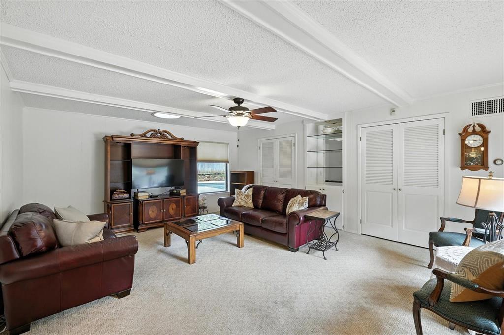 503 Summit Ridge Drive Euless, TX 76039 - Photo 16 of 40 a living room with furniture and a flat screen tv