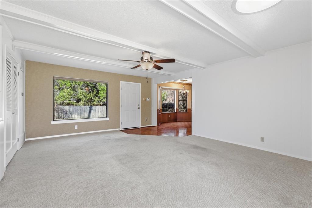 503 Summit Ridge Drive Euless, TX 76039 - Photo 18 of 38 an empty room with windows and ceiling fan