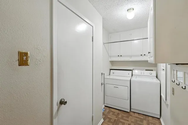 a living room with furniture a fireplace and a chandelier