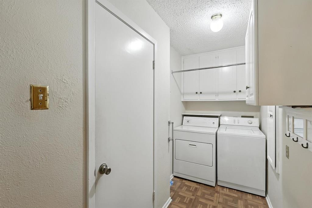 503 Summit Ridge Drive Euless, TX 76039 - Photo 20 of 38 a view of washer and dryer with kitchen in the background
