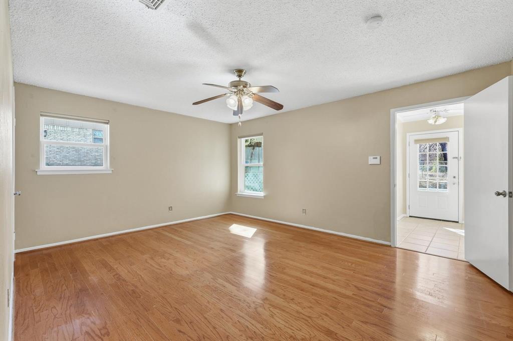 503 Summit Ridge Drive Euless, TX 76039 - Photo 21 of 38 wooden floor in an empty room with a window
