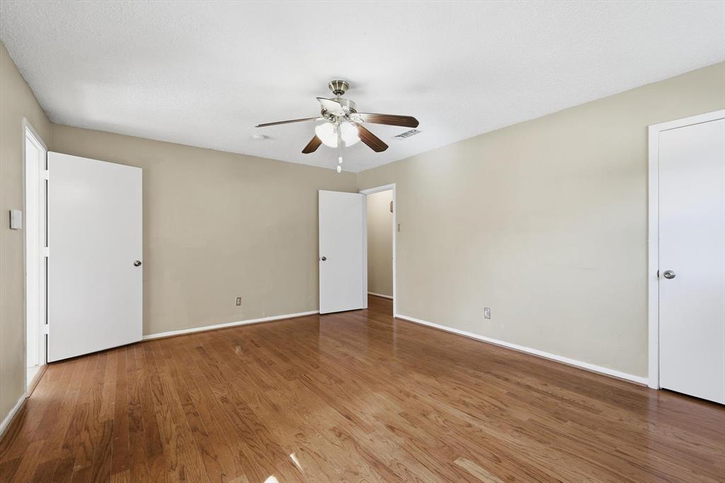 503 Summit Ridge Drive Euless, TX 76039 - Photo 23 of 38 a view of an empty room with wooden floor