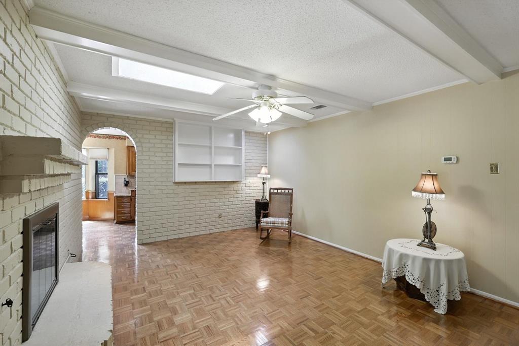 503 Summit Ridge Drive Euless, TX 76039 - Photo 23 of 40 a living room with furniture and a fireplace