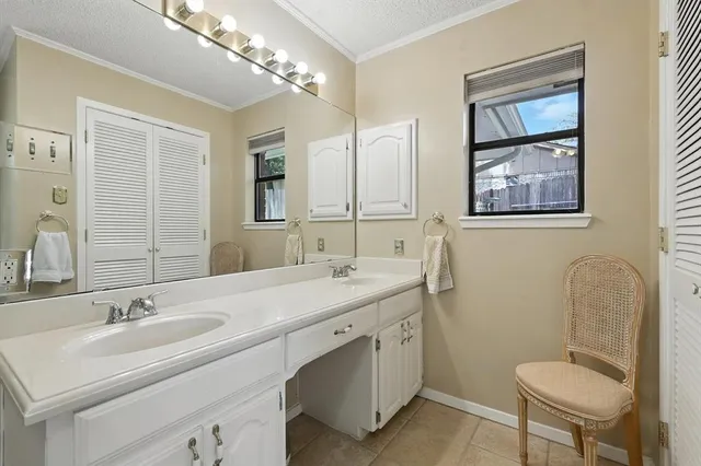 a bathroom with a tub and window