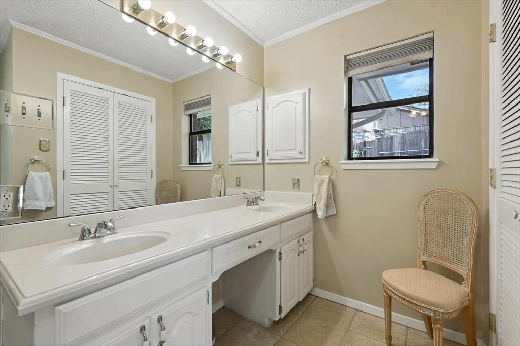 503 Summit Ridge Drive Euless, TX 76039 - Photo 26 of 40 a bathroom with a double vanity sink mirror and double