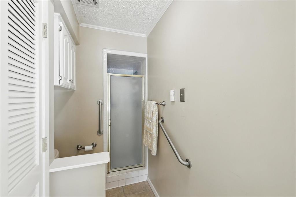 503 Summit Ridge Drive Euless, TX 76039 - Photo 26 of 38 a bathroom with a granite countertop shower and a toilet