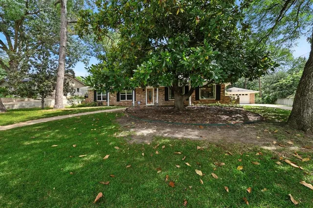 a backyard of a house with lots of green space