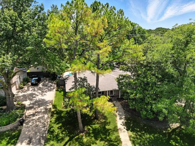 a view of a swimming pool with a patio