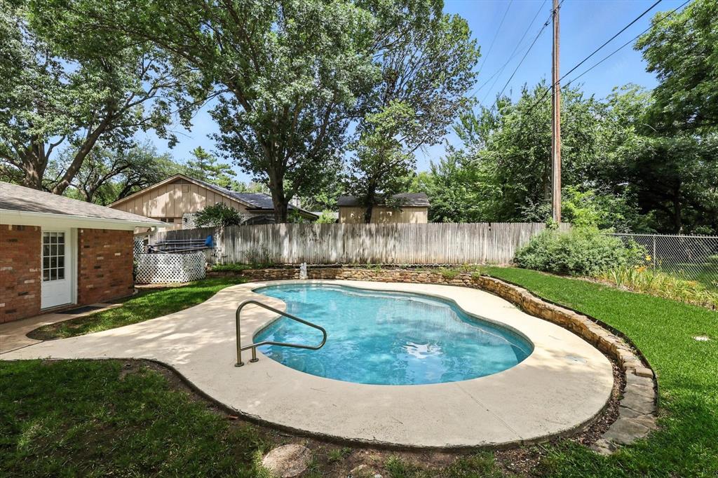 503 Summit Ridge Drive Euless, TX 76039 - Photo 39 of 40 a view of a swimming pool with a patio
