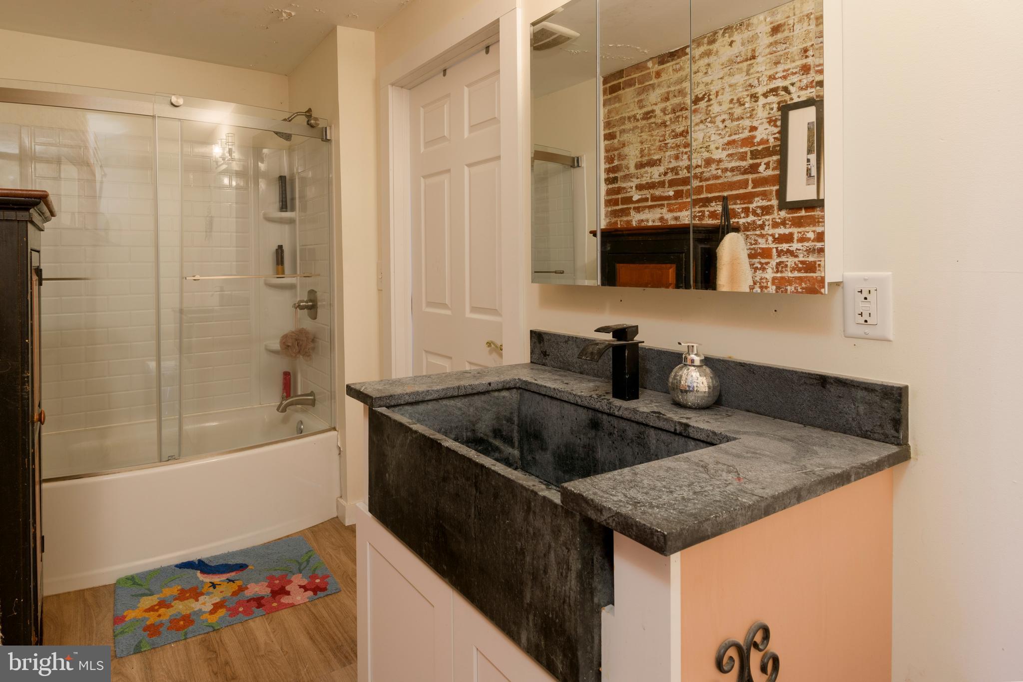 845 Waterway Road Oxford, PA 19363 - Photo 71 of 80 a bathroom with a granite countertop sink and a bathtub
