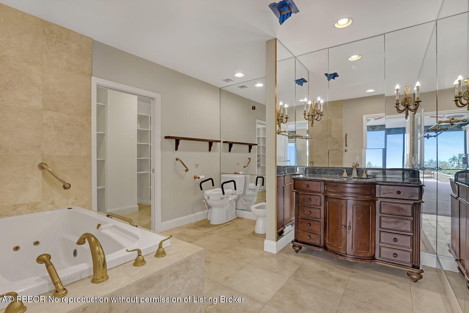 44 Cocoanut Row, Unit 420/421 A Palm Beach, FL 33480 - Photo 16 of 24 a large kitchen with stainless steel appliances kitchen island granite countertop a refrigerator and a sink