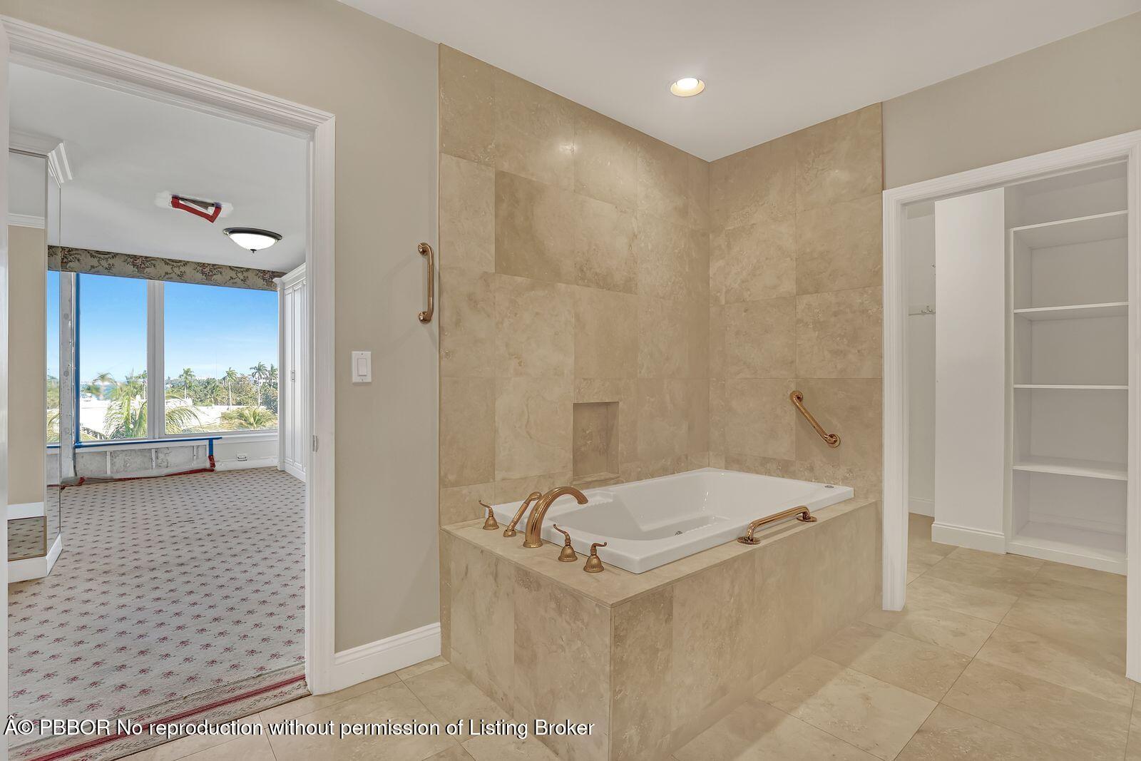 44 Cocoanut Row, Unit 420/421 A Palm Beach, FL 33480 - Photo 10 of 24 a bathroom with a tub a sink and a shower