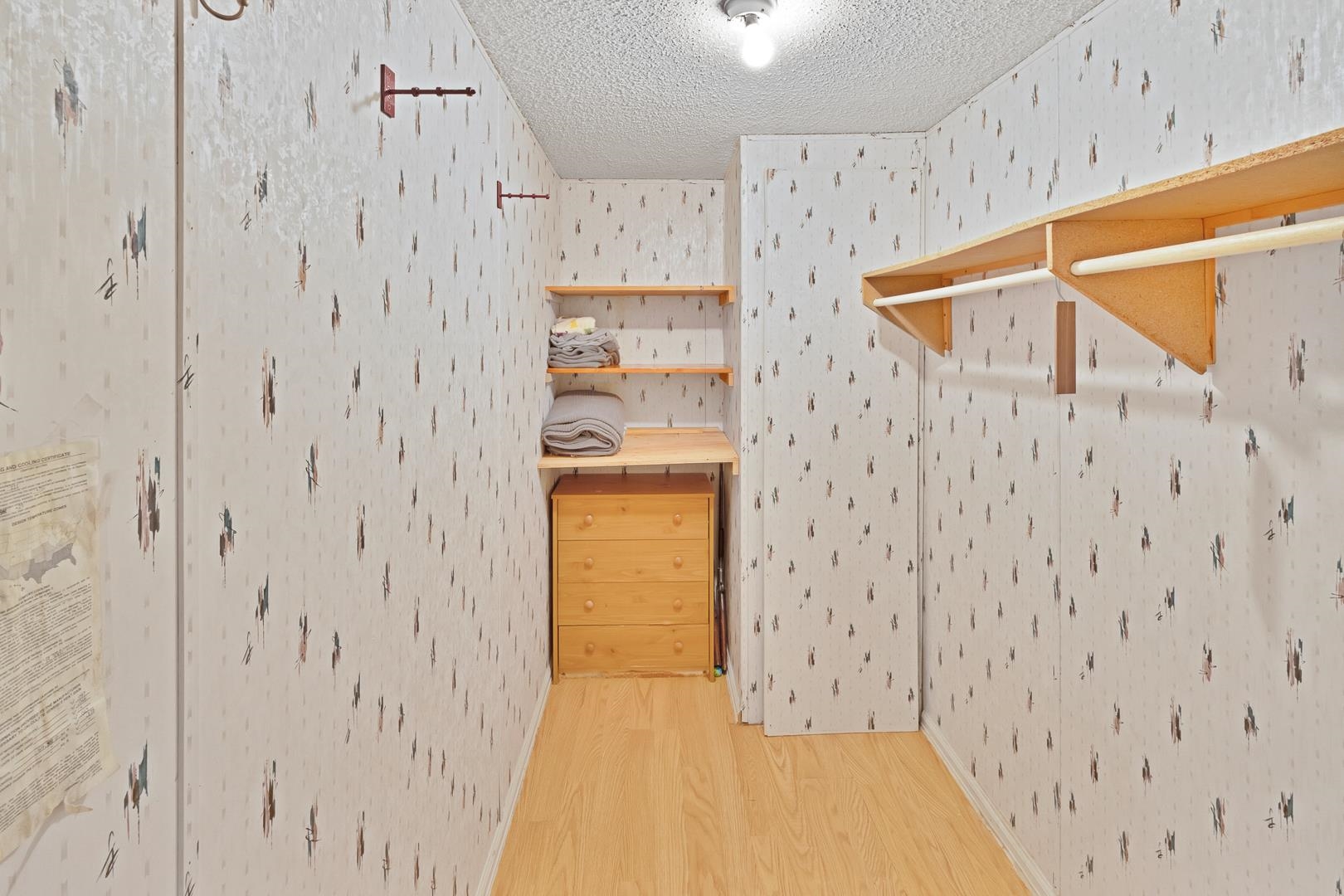 424 32 Road, Unit 271 Clifton, CO 81520 - Photo 17 of 29 a view of a hallway with white cabinets