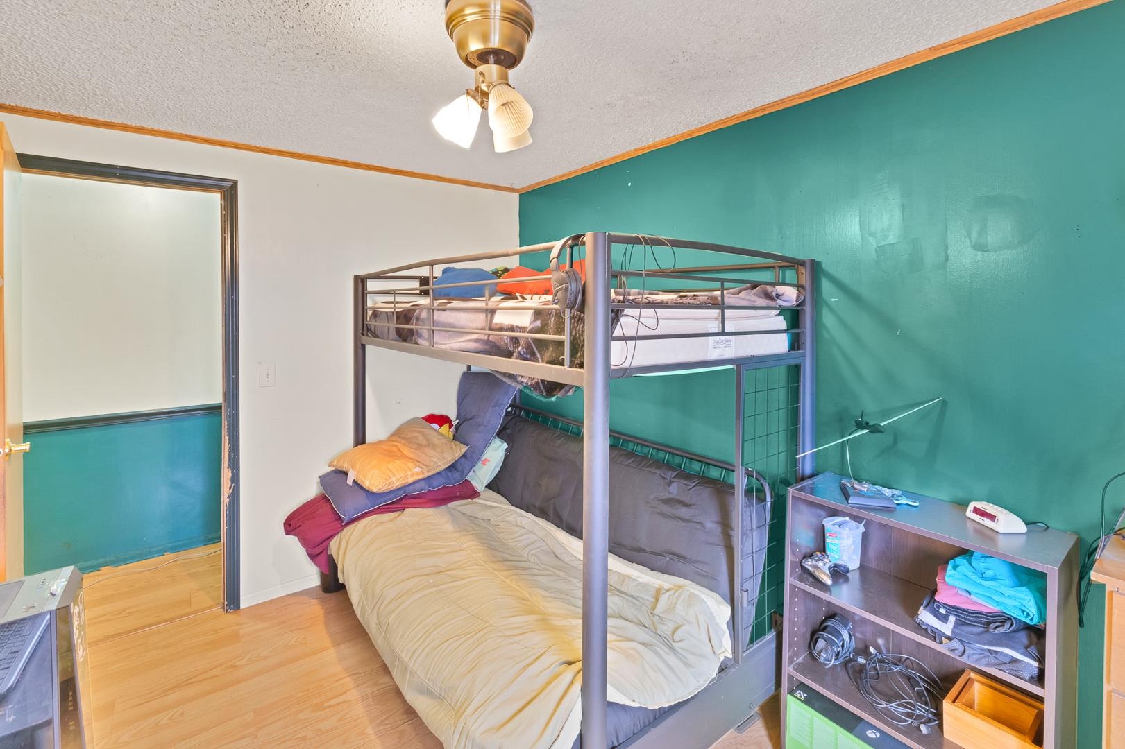 424 32 Road, Unit 271 Clifton, CO 81520 - Photo 23 of 29 a bedroom with a bed and a chandelier