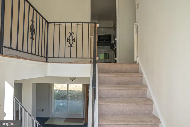 a bedroom with furniture and a wooden floor