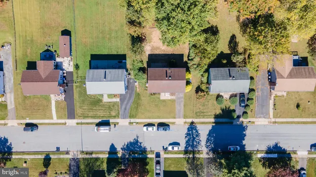 an aerial view of houses with outdoor space