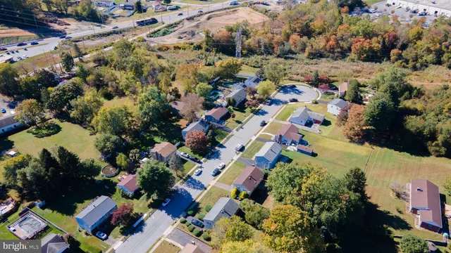 an aerial view of residential house with outdoor space and swimming pool