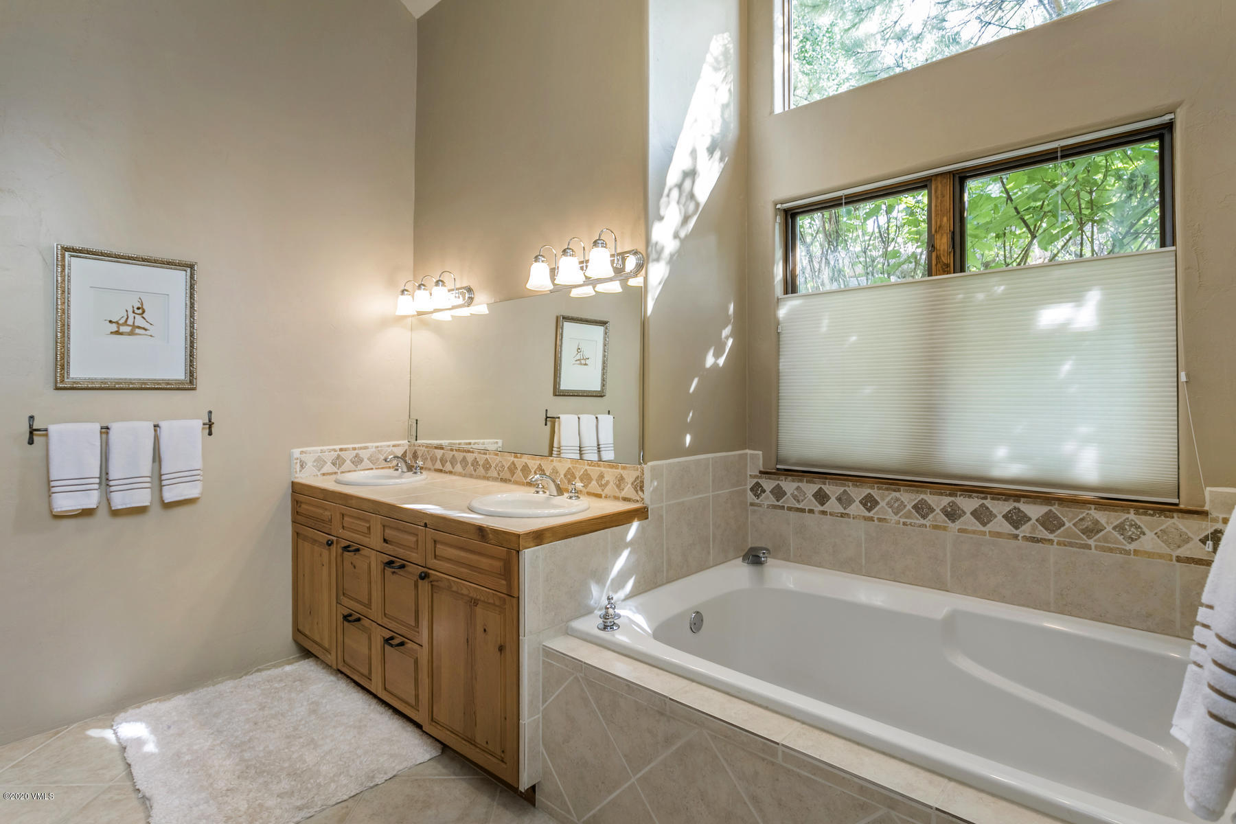 1581 Winslow Road, Unit A Edwards, CO 81632 - Photo 15 of 27 a spacious bathroom with a tub sink and mirror