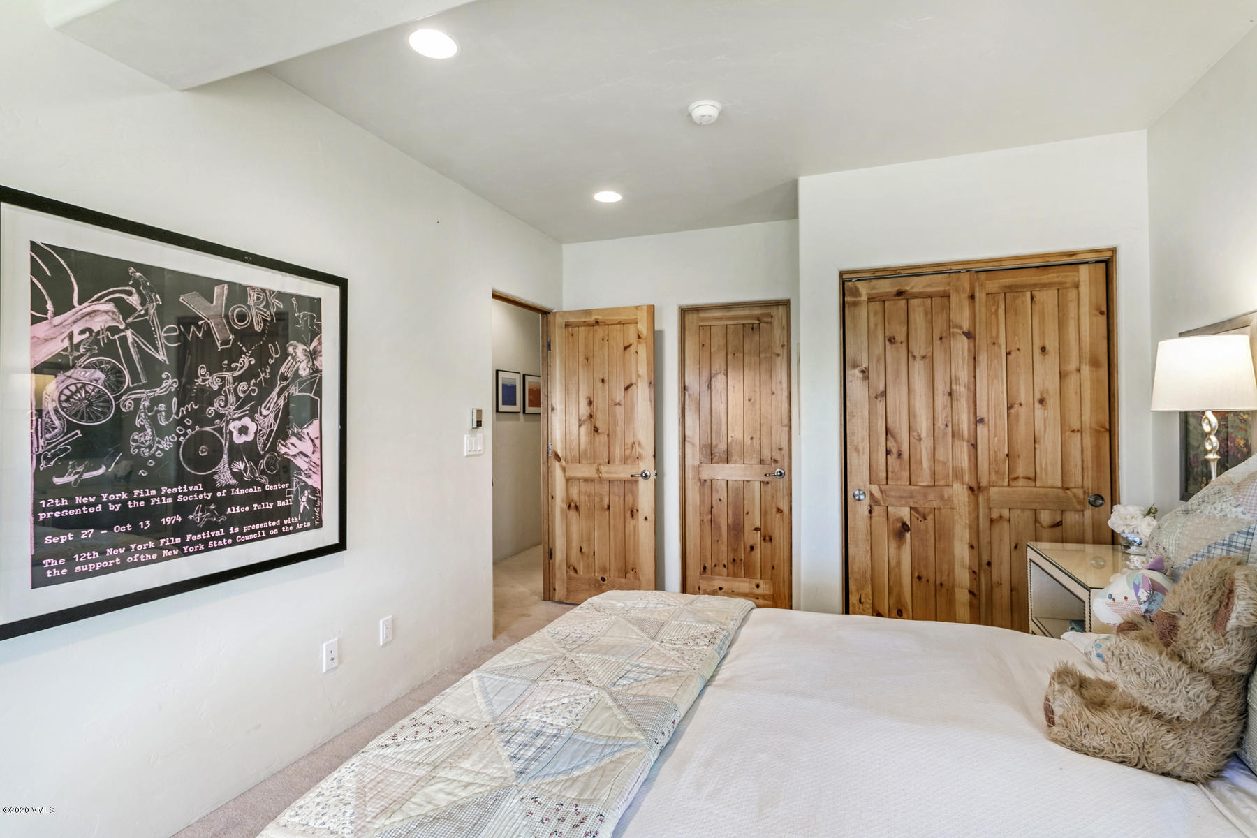 1581 Winslow Road, Unit A Edwards, CO 81632 - Photo 18 of 27 a bedroom with a bed and a painting on the wall