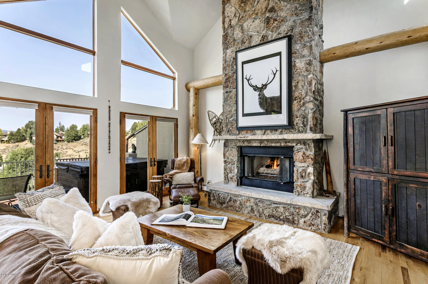 1581 Winslow Road, Unit A Edwards, CO 81632 - Photo 2 of 27 a living room with furniture a fireplace and a large window