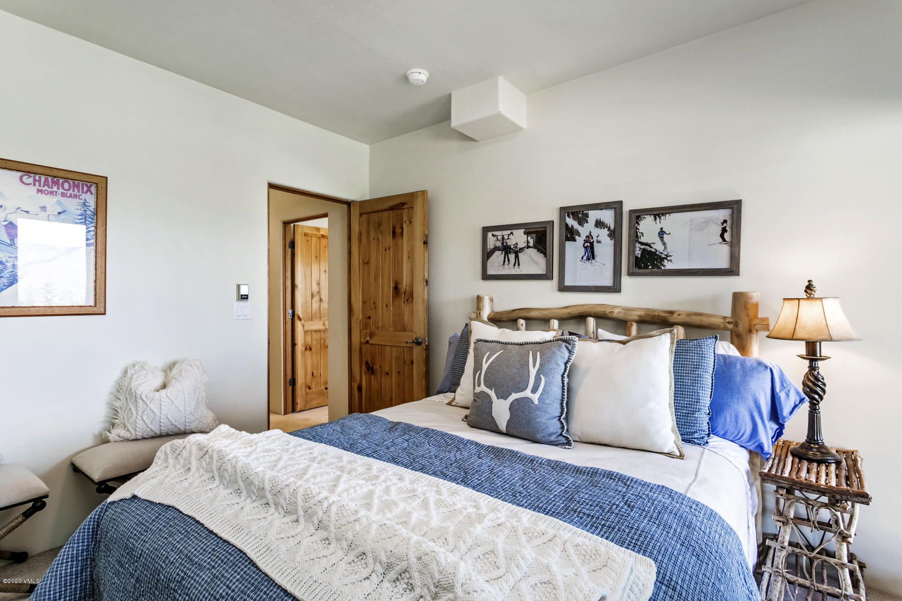 1581 Winslow Road, Unit A Edwards, CO 81632 - Photo 21 of 27 a bedroom with bed and painting on the wall
