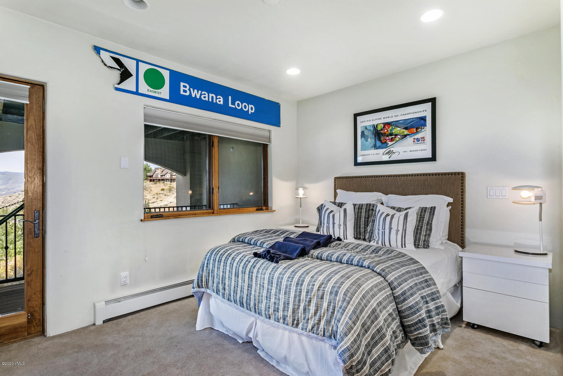 1581 Winslow Road, Unit A Edwards, CO 81632 - Photo 22 of 27 a bedroom with a bed and a painting on the wall