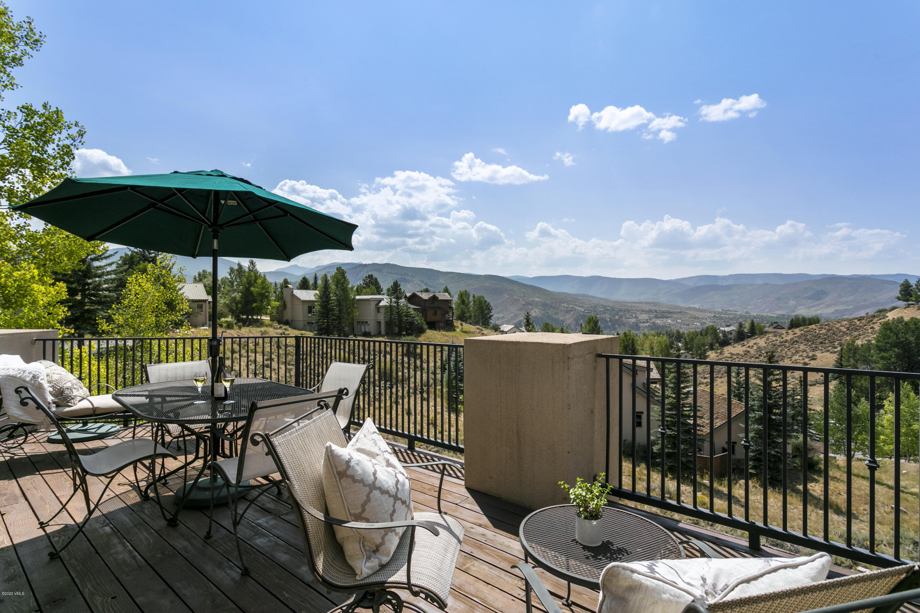 1581 Winslow Road, Unit A Edwards, CO 81632 - Photo 26 of 27 a view of a balcony with furniture and umbrella