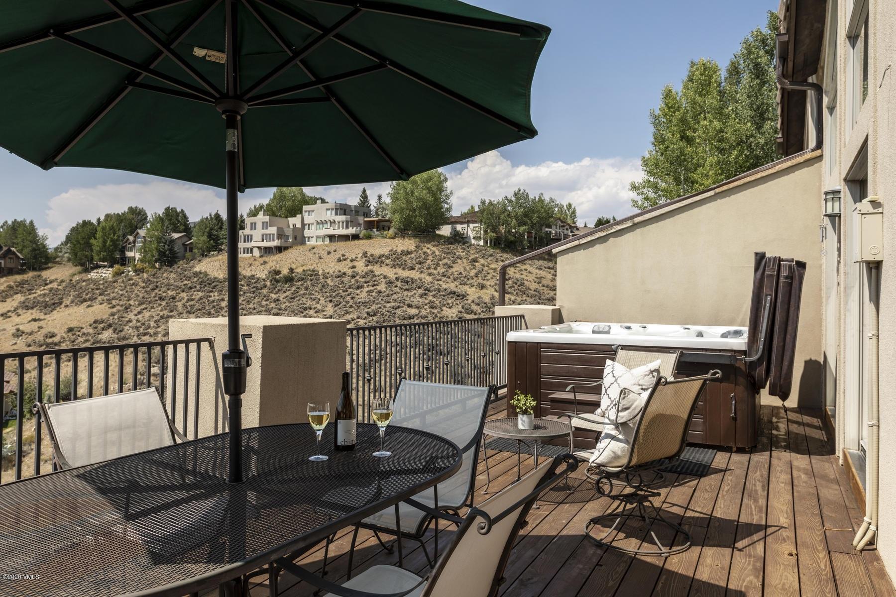 1581 Winslow Road, Unit A Edwards, CO 81632 - Photo 27 of 27 a view of balcony with furniture and umbrella