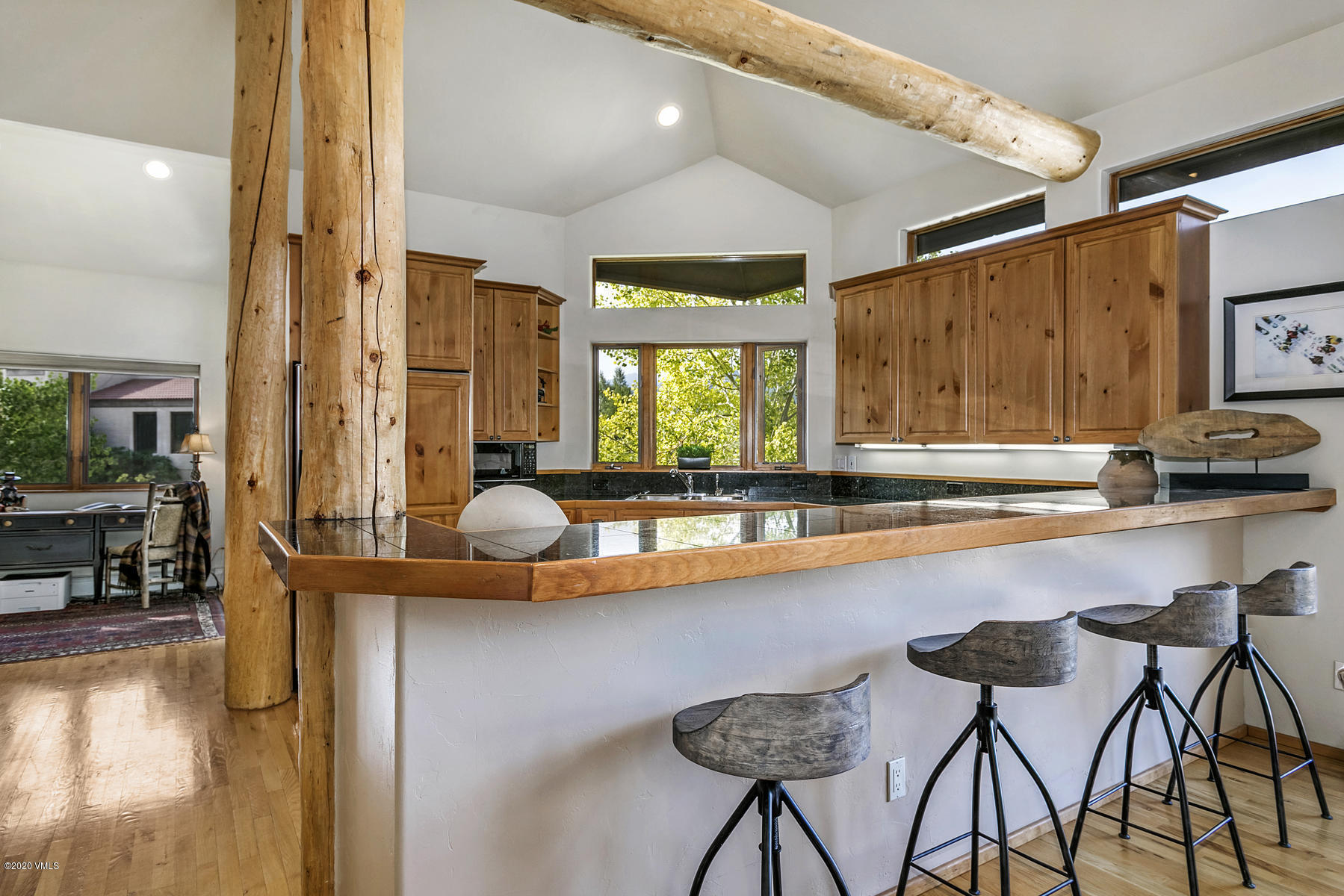 1581 Winslow Road, Unit A Edwards, CO 81632 - Photo 8 of 27 a kitchen with a table chairs sink and cabinets