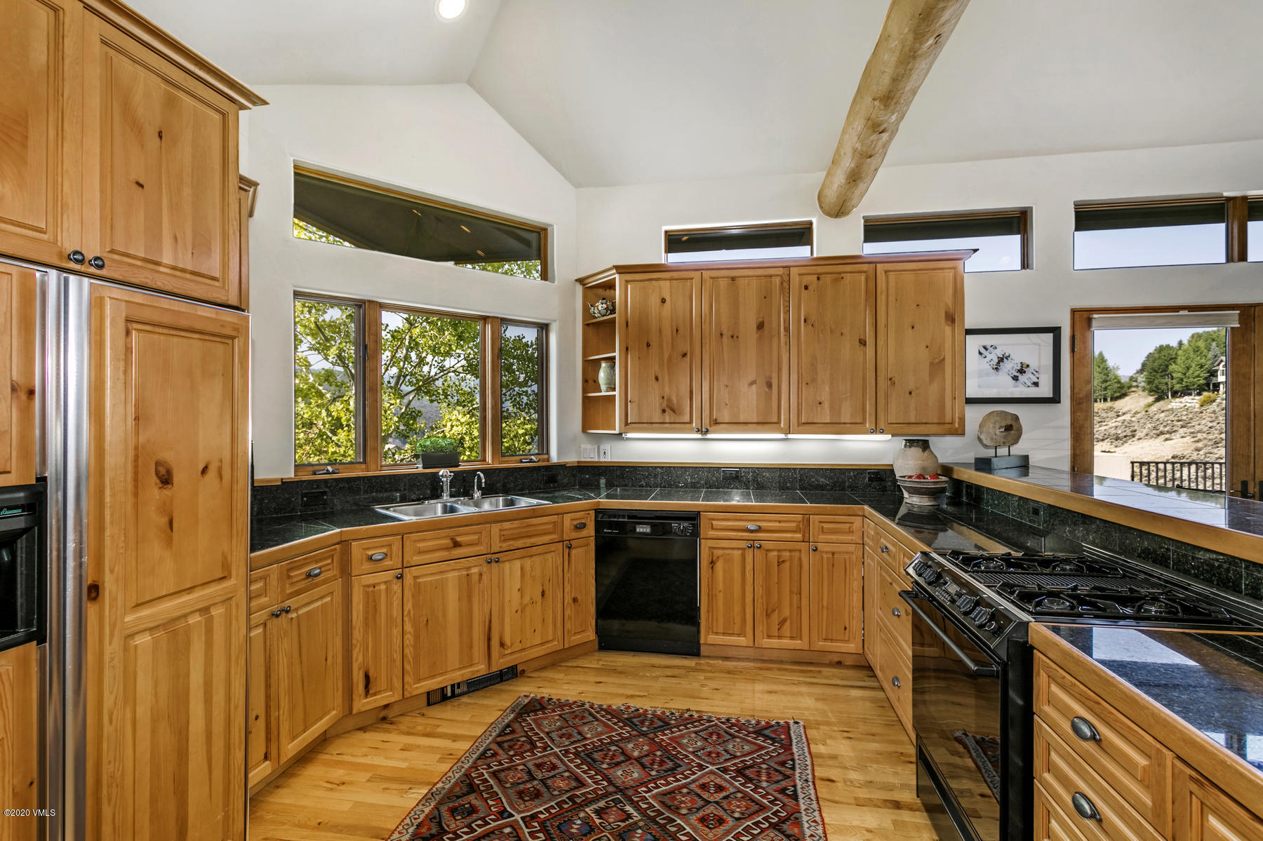1581 Winslow Road, Unit A Edwards, CO 81632 - Photo 9 of 27 a kitchen with a sink stove and cabinets