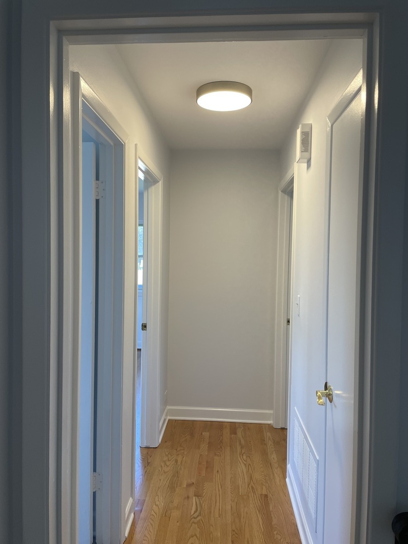 449 Yarmouth Road Elk Grove Village, IL 60007 - Photo 19 of 48 a view of hallway with closet and wooden floor